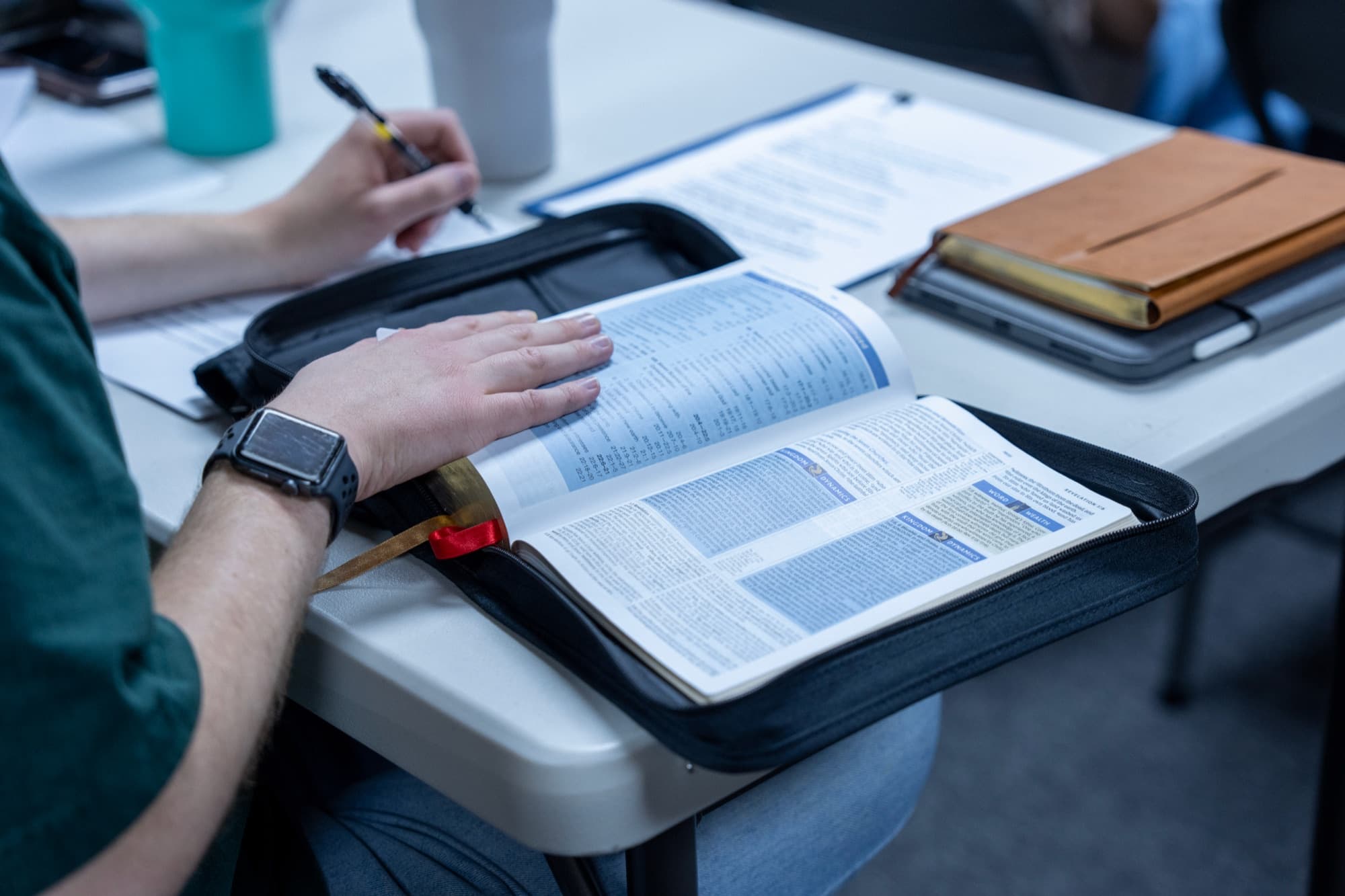 A study Bible open on a table during teaching