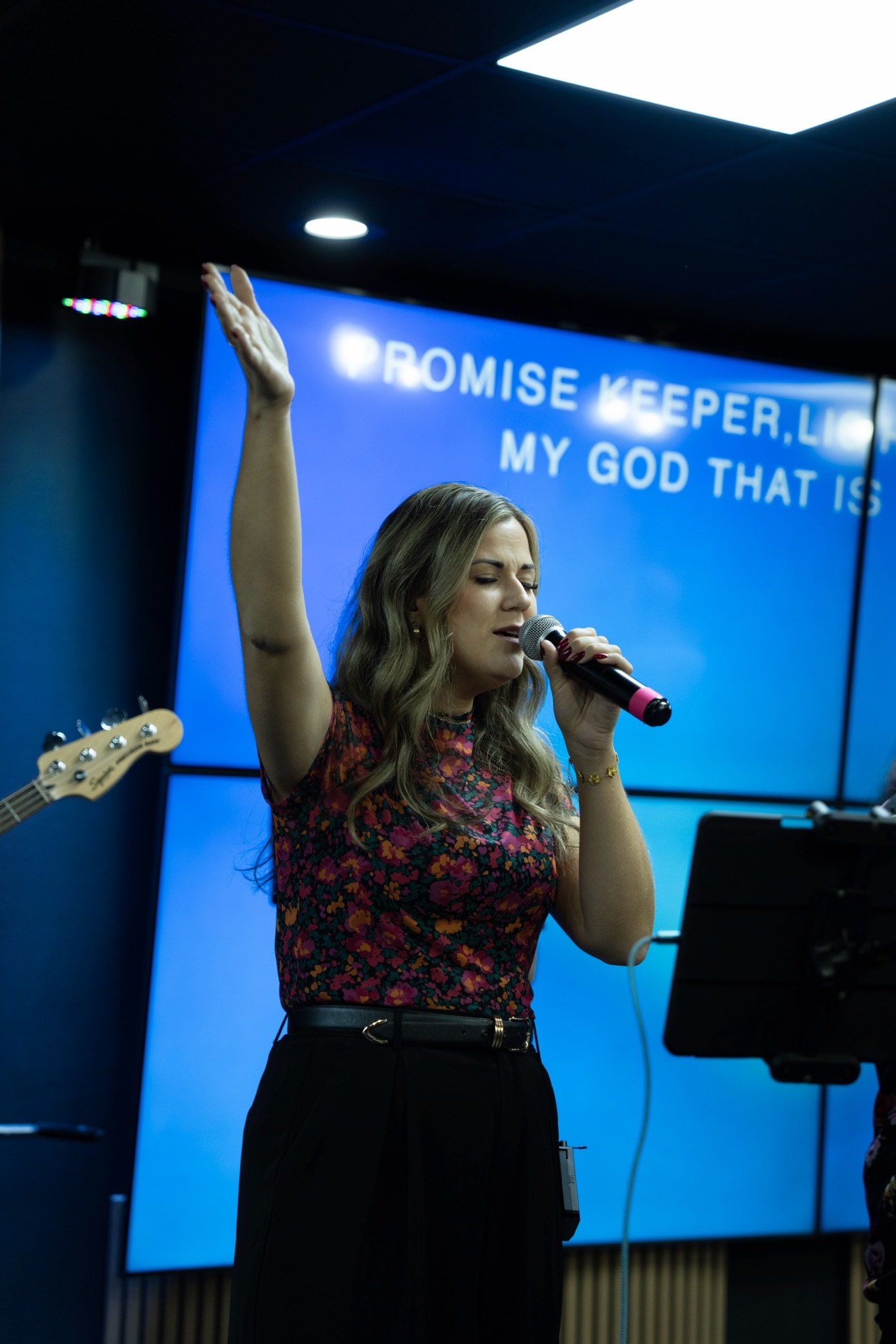 Leading worship with a raised hand